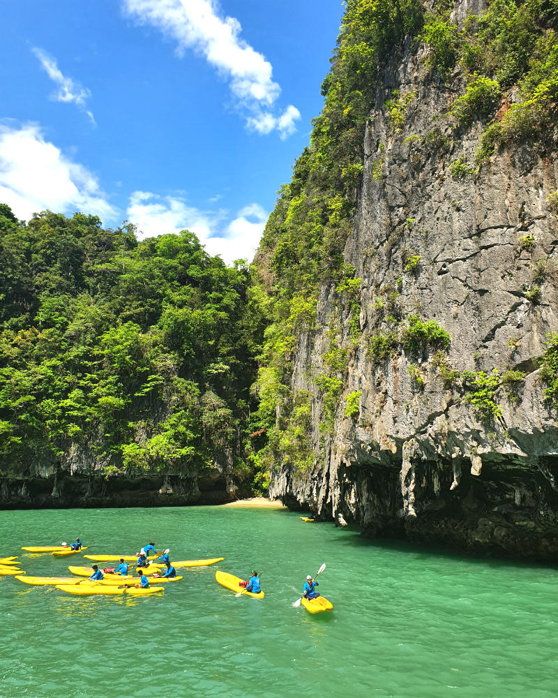 Kayaking to explore a Hong (cave)