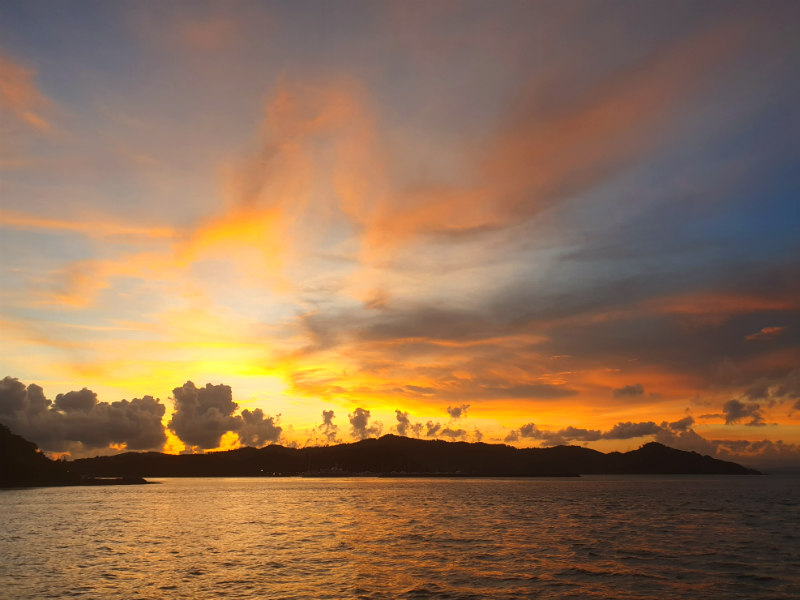 Sailing an idyllic cruise in the sunset